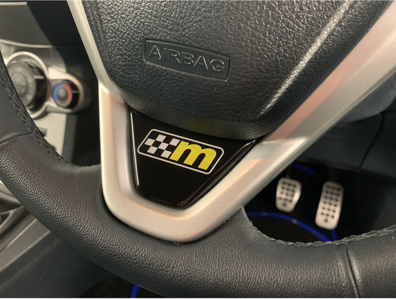 Load image into Gallery viewer, Fiesta Mk7 Mk7.5 Steering Wheel Lower Gel Badge - M Logo
