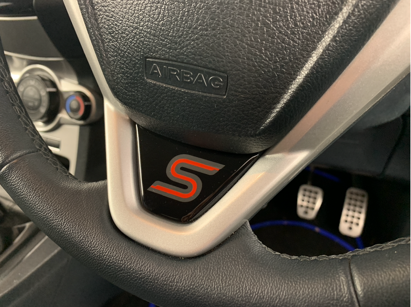 Load image into Gallery viewer, Fiesta Mk7 Mk7.5 Steering Wheel Lower Gel Badge - S Logo
