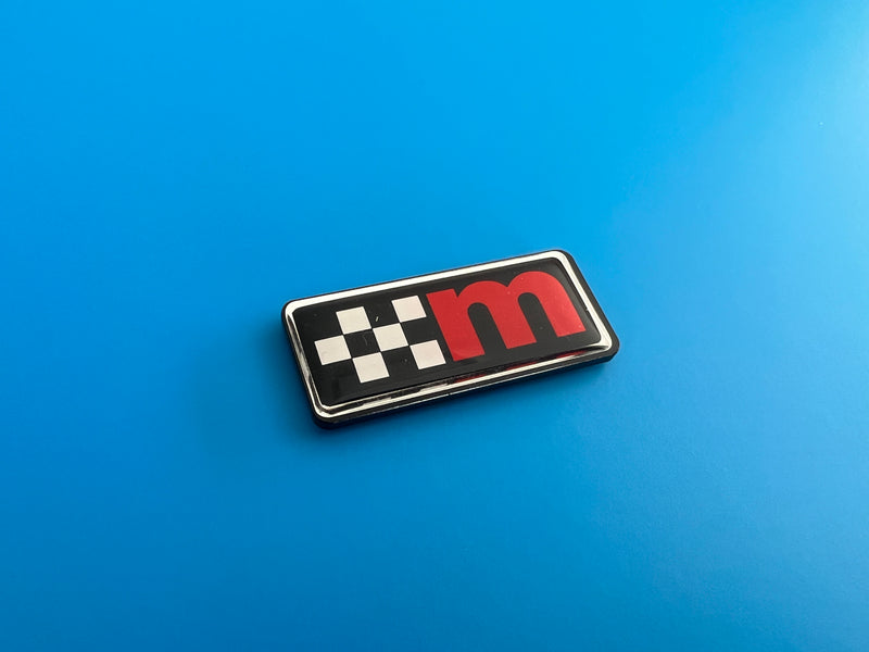 Load image into Gallery viewer, M Logo Gel Badges with Perspex Backing
