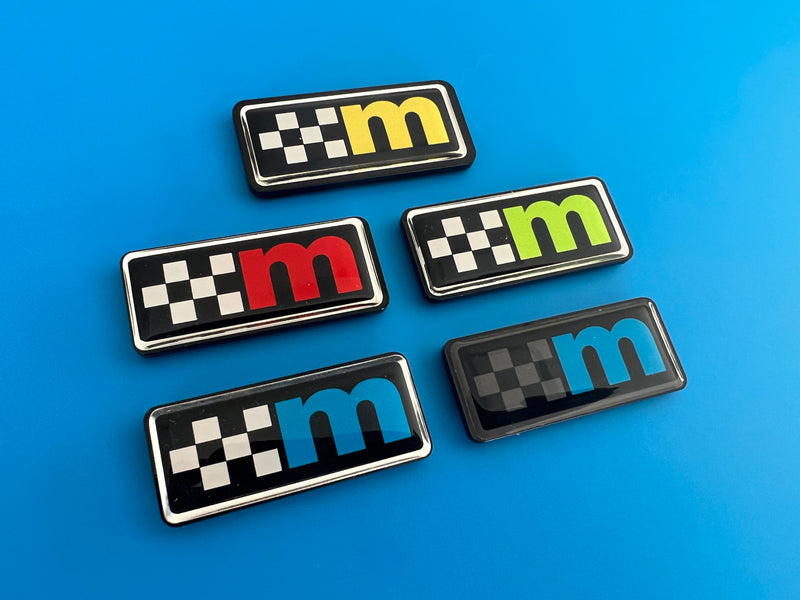 Load image into Gallery viewer, M Logo Gel Badges with Perspex Backing
